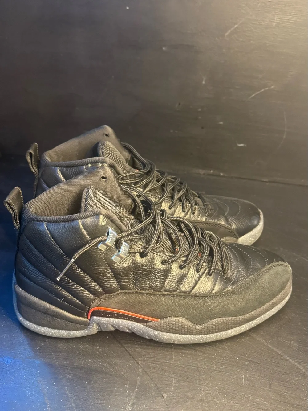 Men's Jordan 12 Black High-Top Athletic Sneakers with Subtle Orange Accent